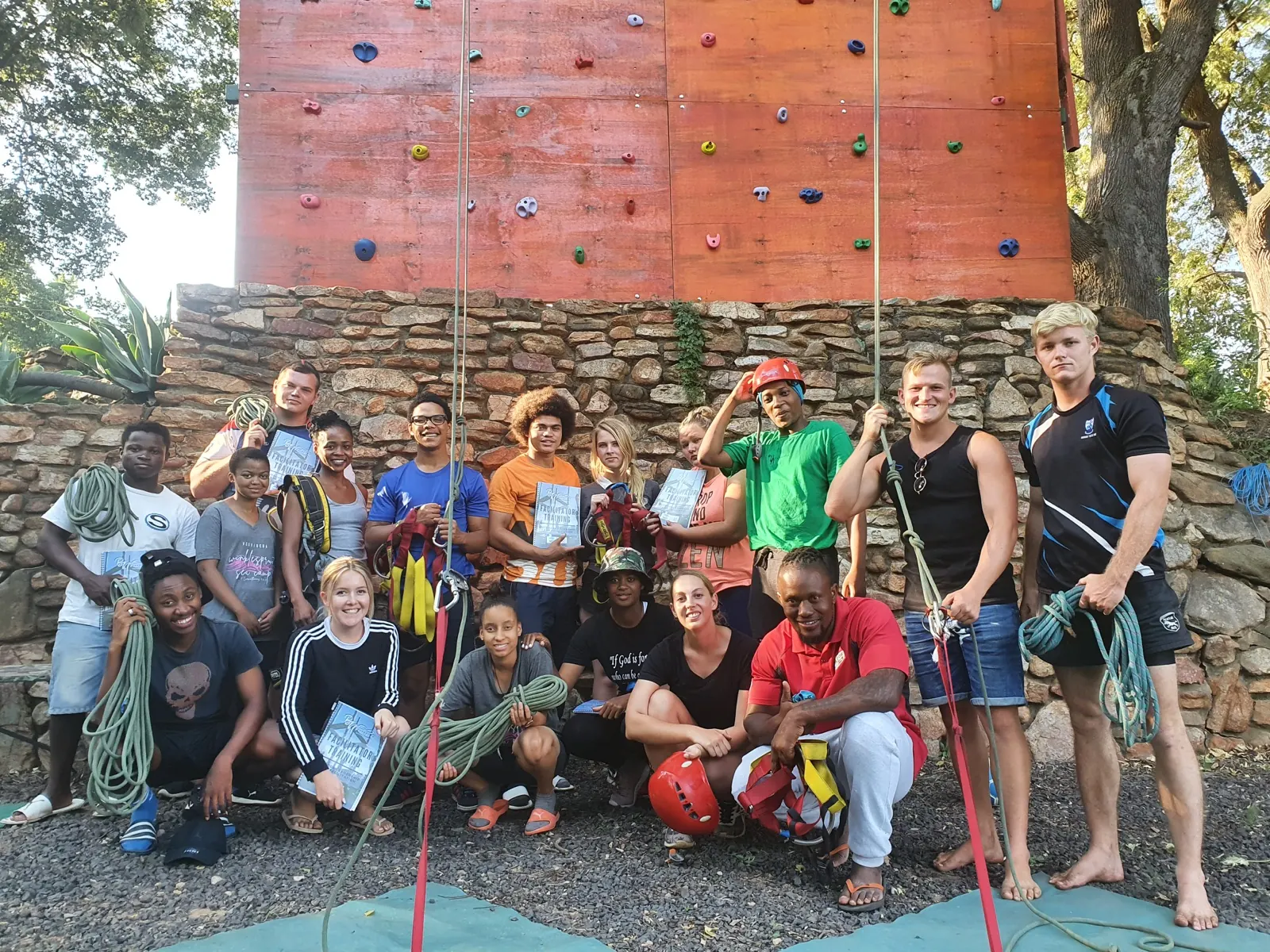 A group of outdoor-learning practitioners with climbing equipment